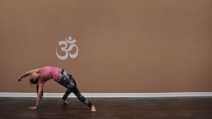 Woman doing revolving beam yoga pose