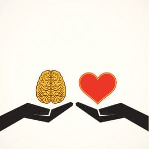 Two hands, one holding a brain and the other holding a heart